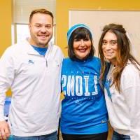 President Mantella poses with Christen and Doug Fox at the pre-game tailgate party